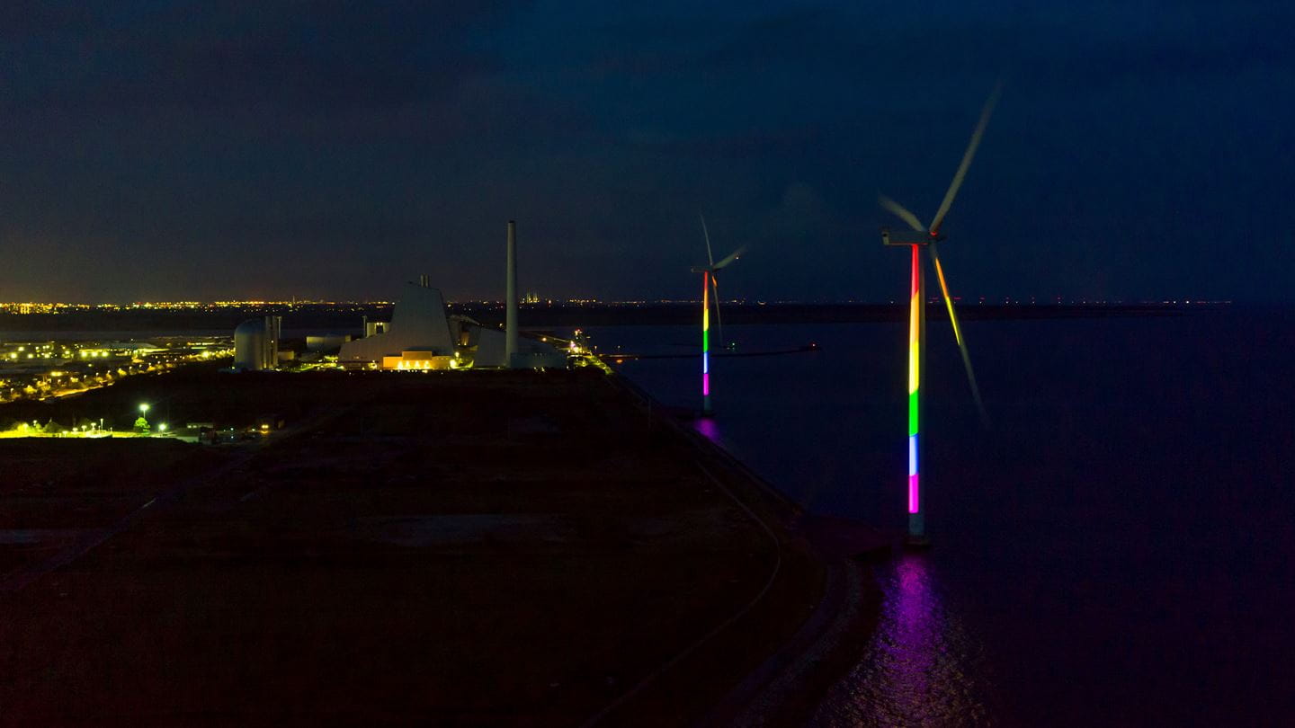 Two of the three wind turbines at Avedøre Power Station during the installation of the rainbow lights.