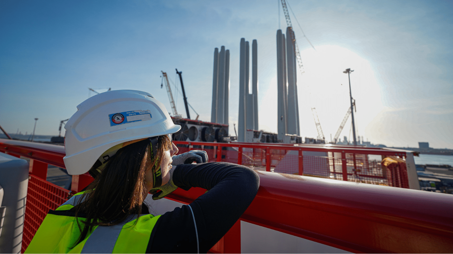 ederation University student Mia Danko exploring Ørsted’s offshore wind port in Taichung where turbine foundations, blades and towers are being prepared for loading at the dock before their installation at sea.