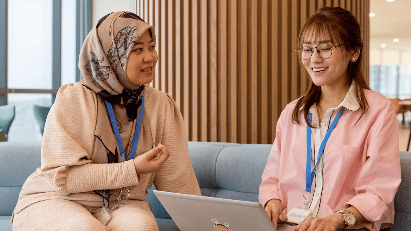 Employees working with a laptop, office, Kuala Lumpur, MY, Malaysia