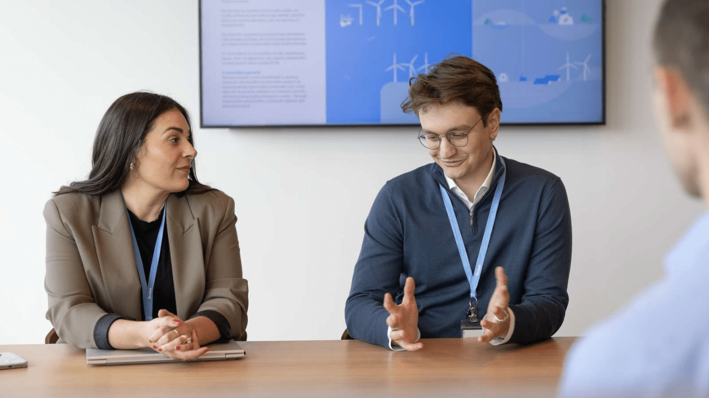 Providence Office, US employees collaborating, chatting, in the meeting, working.