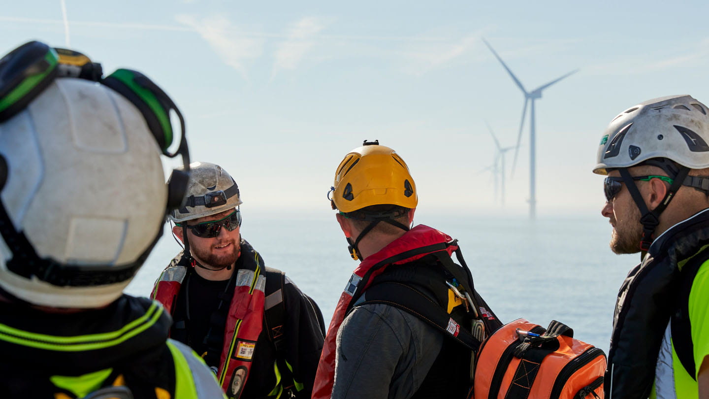 Technicians working in an offshore wind farm