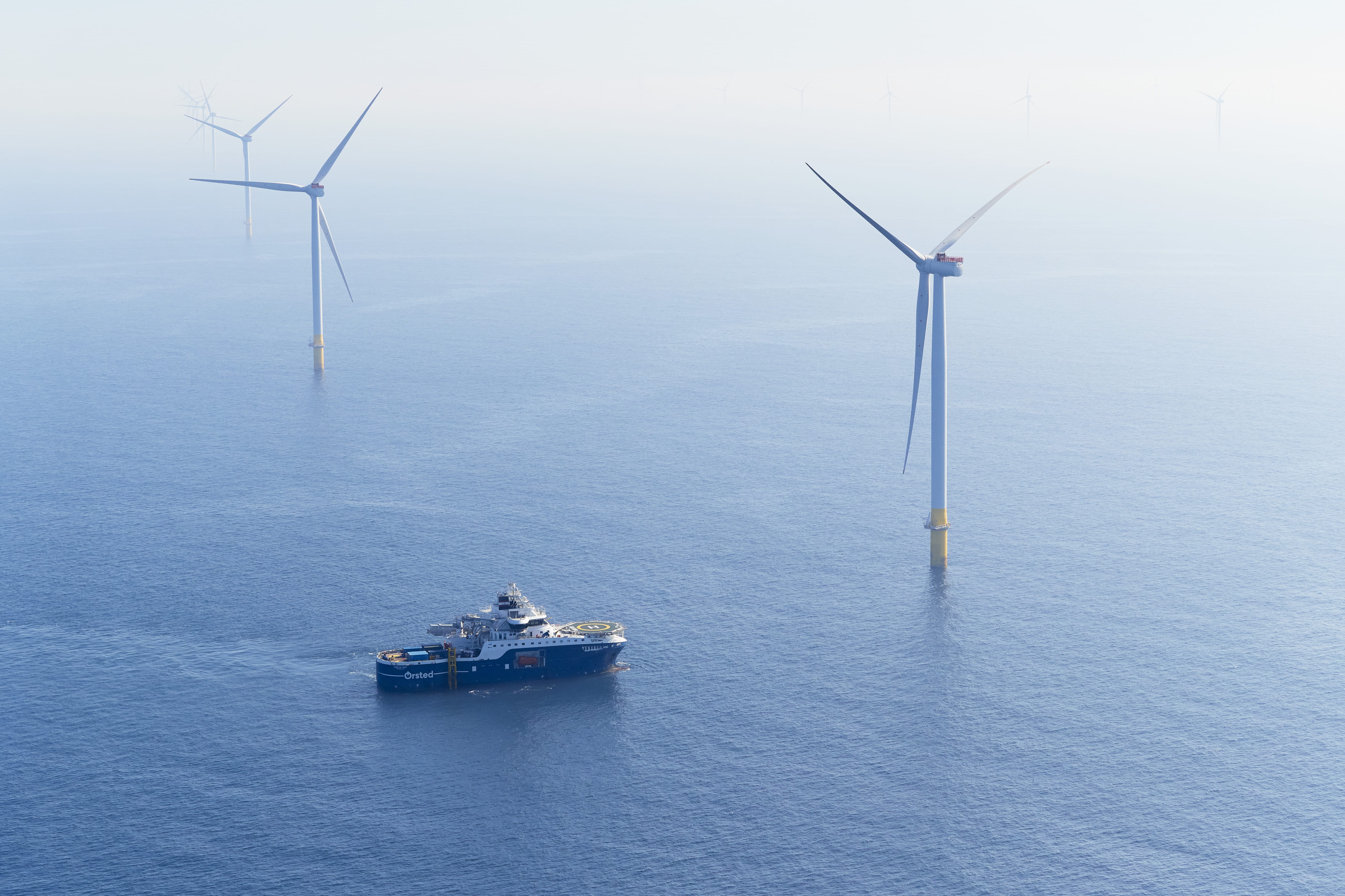 Hornsea 2 Offshore Wind Farm with a SOV sailing between the turbines