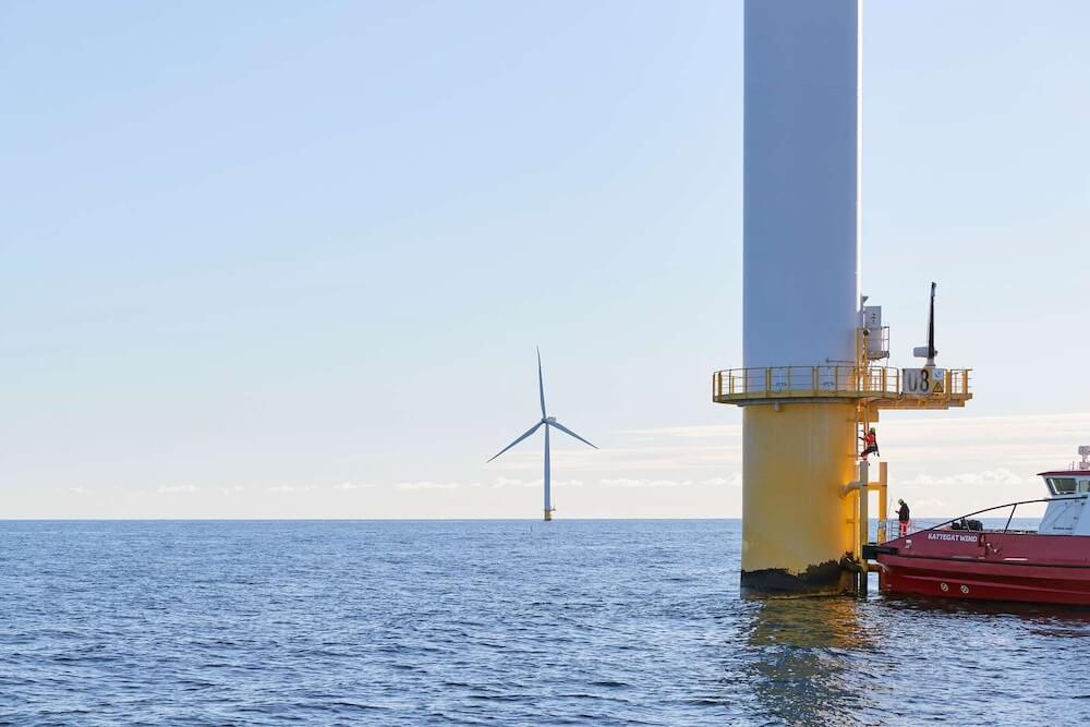 Image of an offshore wind turbine and vessel