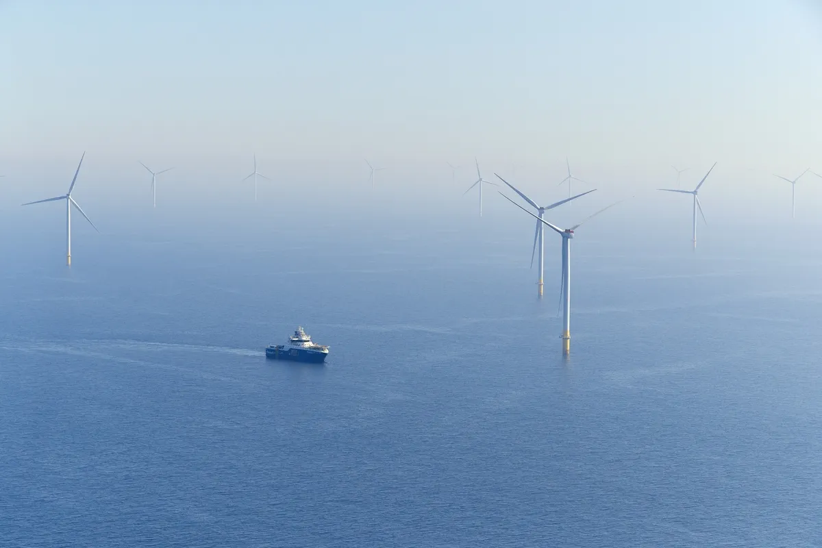 Hornsea 2 offshore wind turbines and a boat looking very small in comparison