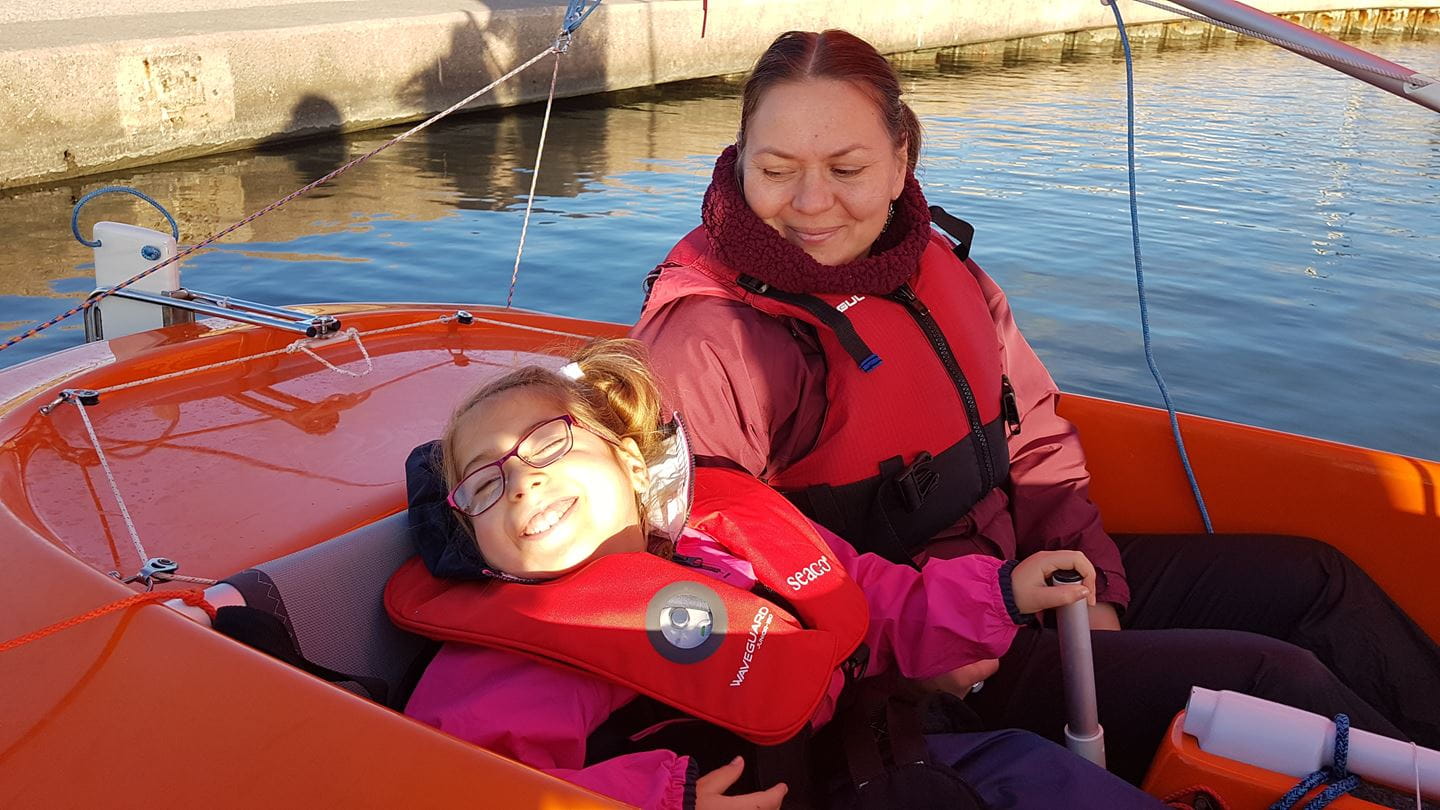 Amelia and her mum Sylwia on Rhyl Marine Lake in All Afloats accessible boats