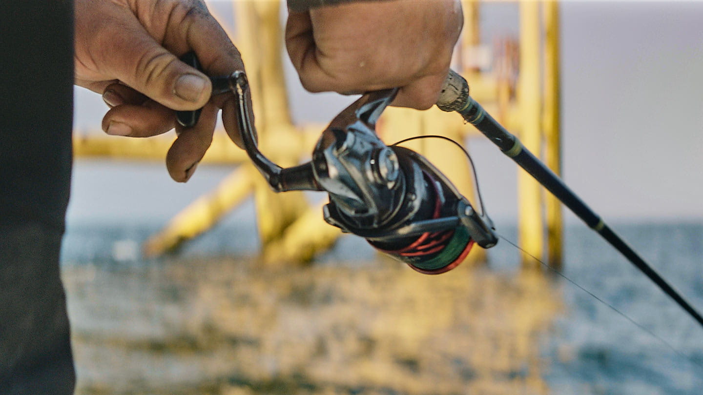 Close-up of a fishing rod held by Hank Hewitt, professional angler, Block Island local, and offshore wind supporter.