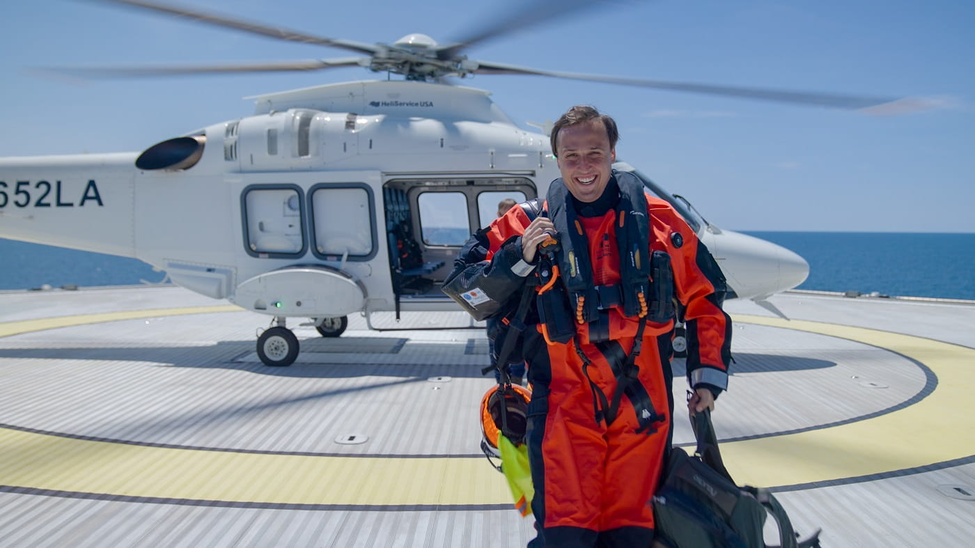 Helicopter and a man smiling