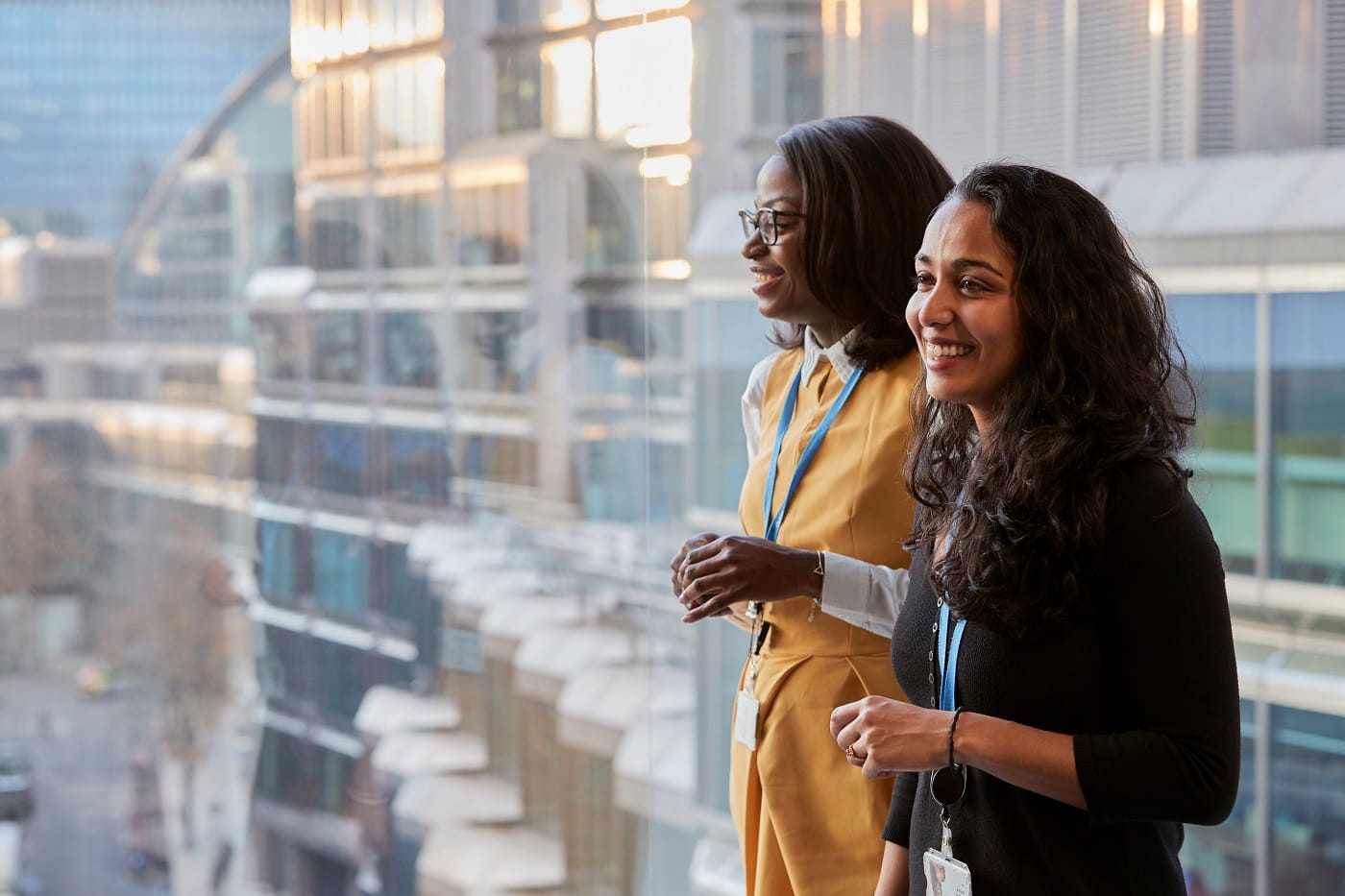 Two employees by a window