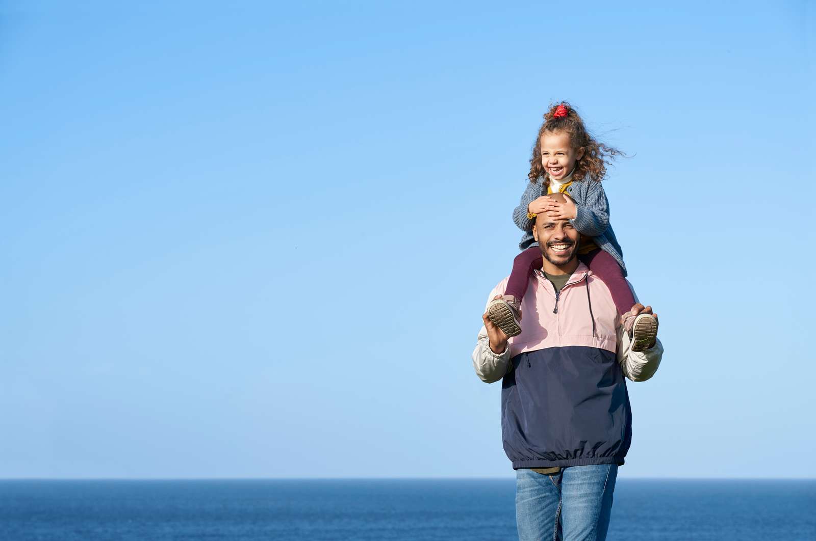 A man with a child on his shoulders