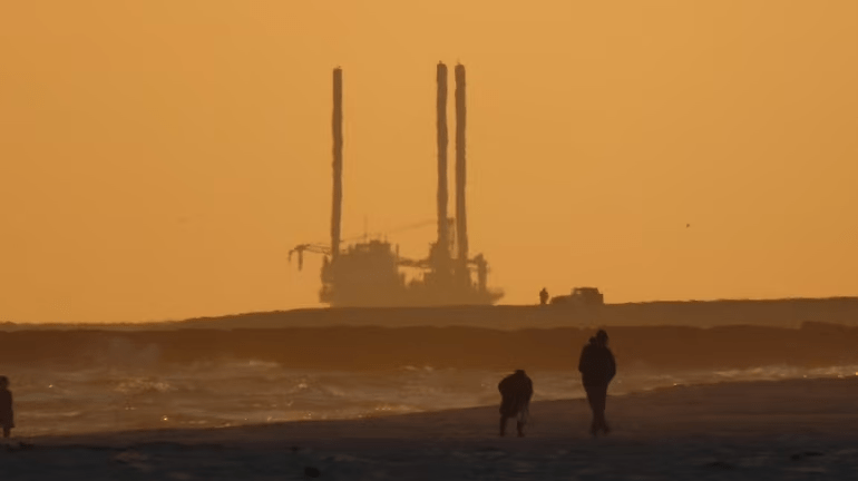 A self-elevating barge off Smith Point, as seen from Moriches Inlet, conducting sea-floor survey work for the Sunrise Wind farm on Nov. 29, 2020. Credit: Newsday / Mark Harrington