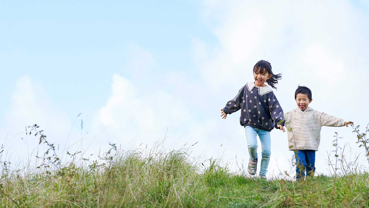 Running kids on grass